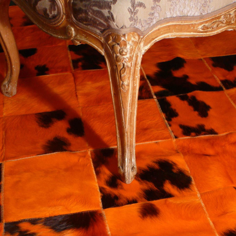 Tapis patchwork en peau de vache orange